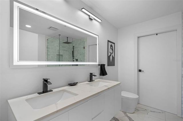 bathroom with vanity, toilet, and walk in shower