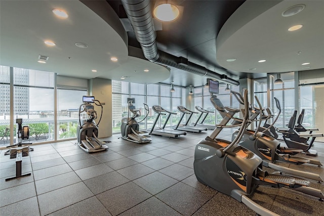 gym featuring a wall of windows