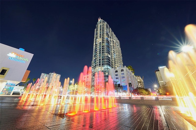 property at twilight featuring a view of city lights