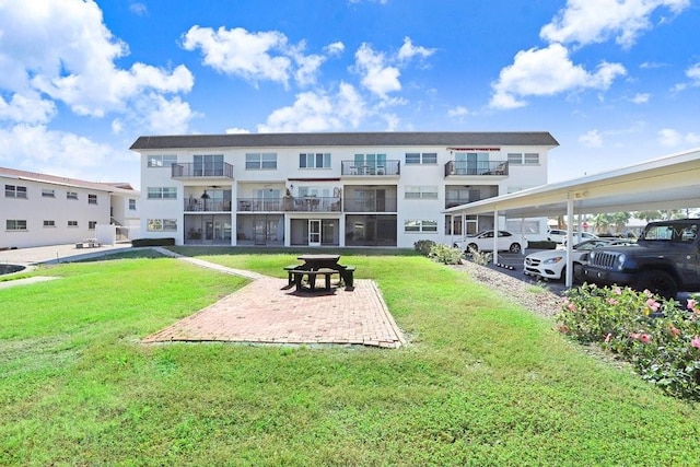 view of property's community with a lawn