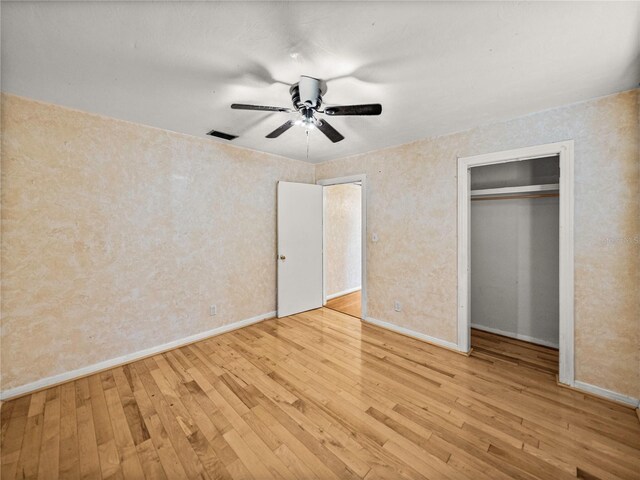 unfurnished bedroom featuring light hardwood / wood-style floors and ceiling fan