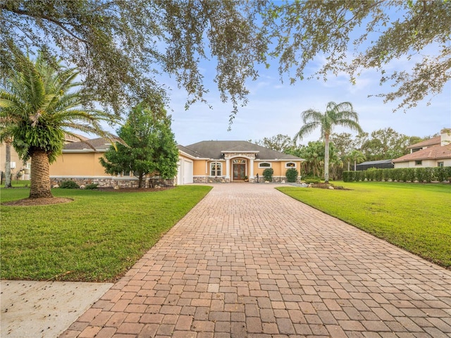 ranch-style home with a front lawn