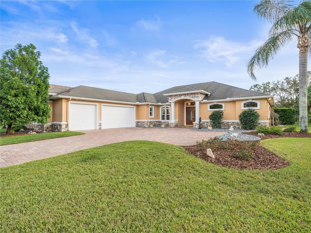 view of front facade with a garage and a front yard