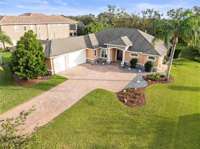 view of front of property with a garage and a front yard