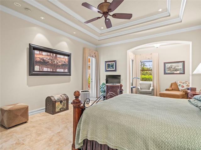 bedroom with ornamental molding, a tray ceiling, light tile patterned floors, and ceiling fan