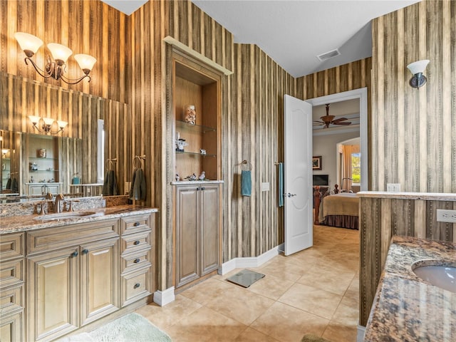 bathroom featuring ceiling fan, vanity, tile patterned floors, and built in shelves