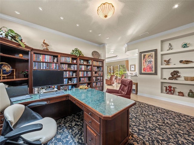 office space featuring built in desk, built in shelves, a textured ceiling, wood-type flooring, and crown molding