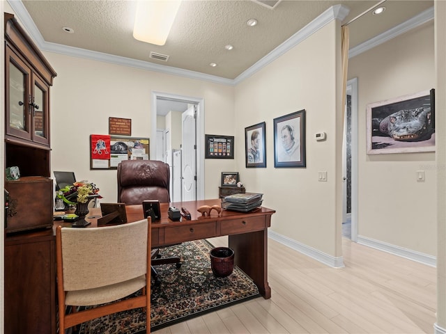 office area with a textured ceiling, light wood-type flooring, and crown molding