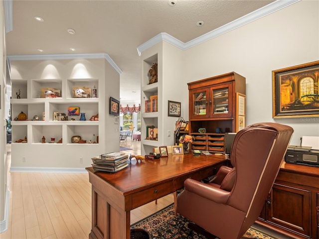 office area with light hardwood / wood-style floors, built in features, a textured ceiling, and crown molding