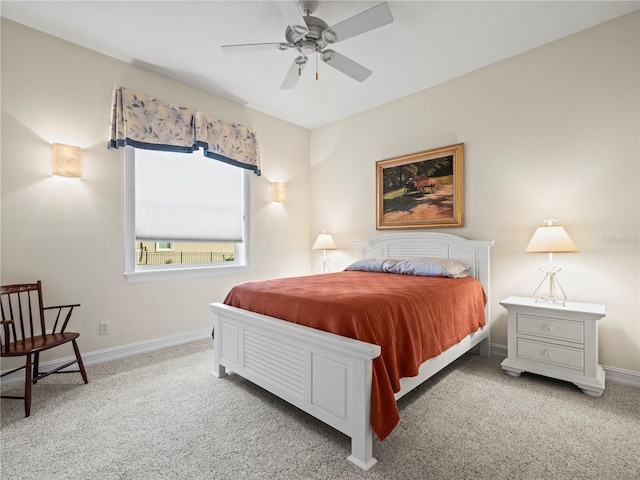 bedroom with ceiling fan and carpet floors