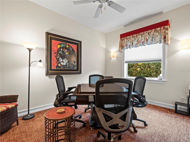 carpeted office space with ceiling fan