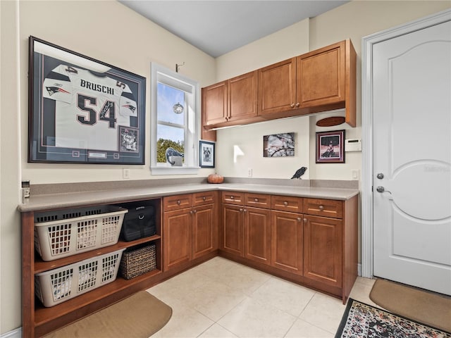 kitchen with light tile patterned flooring