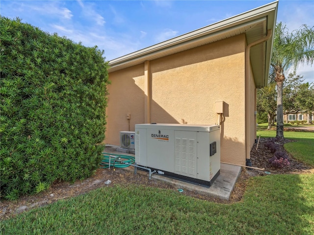 exterior space with a lawn and ac unit