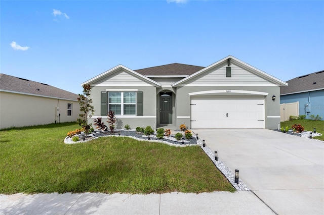 ranch-style house with a garage and a front yard