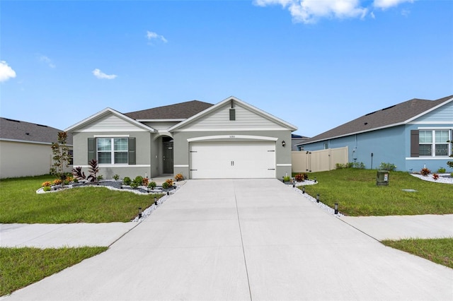 ranch-style house with a garage and a front lawn