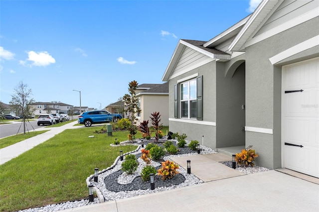 view of side of home featuring a lawn