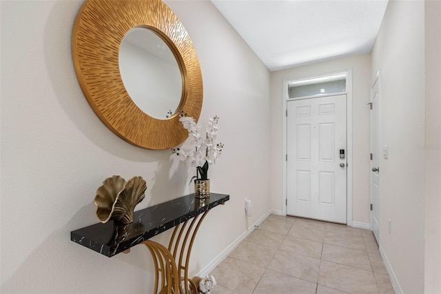 foyer featuring light tile patterned floors