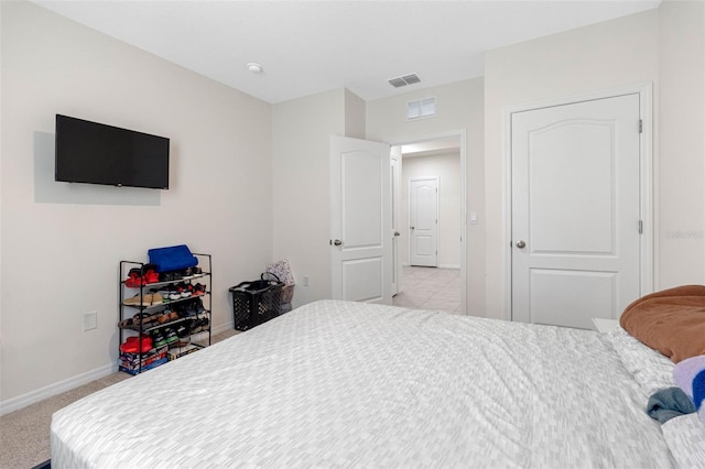 bedroom with light colored carpet