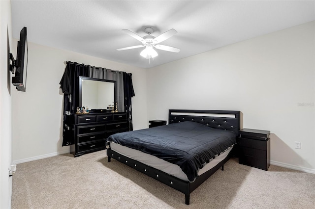 bedroom featuring light colored carpet and ceiling fan