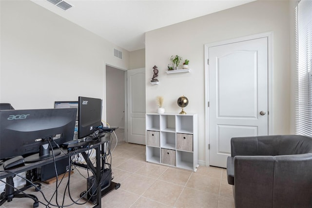 office space with light tile patterned floors