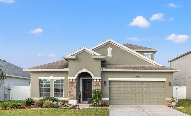 front of property featuring a garage and a front lawn