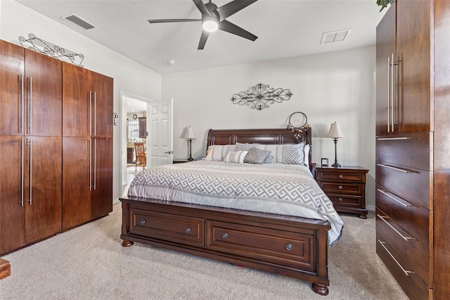 bedroom with ceiling fan and light colored carpet