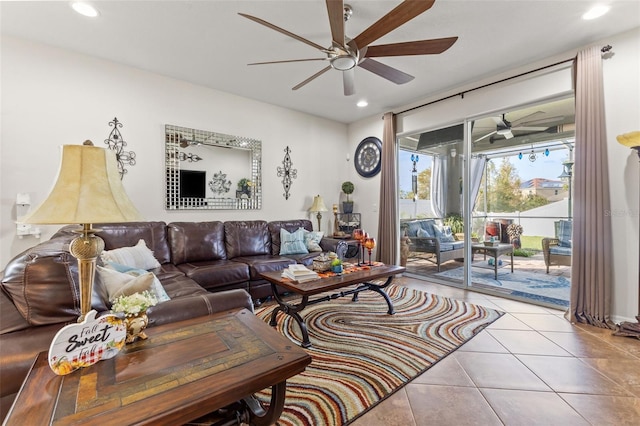 living room featuring ceiling fan and light tile patterned floors