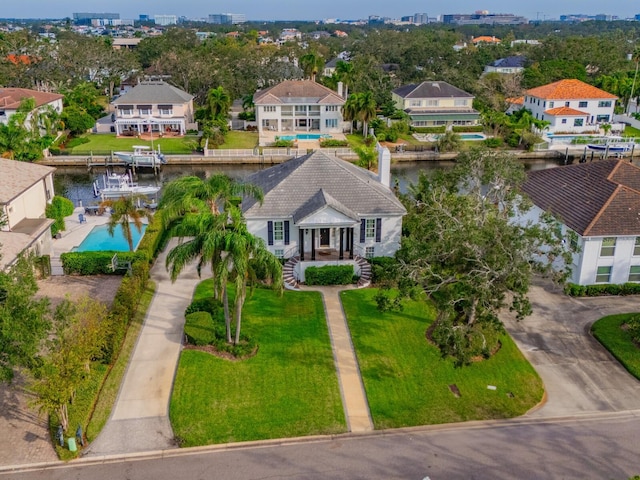 birds eye view of property with a water view