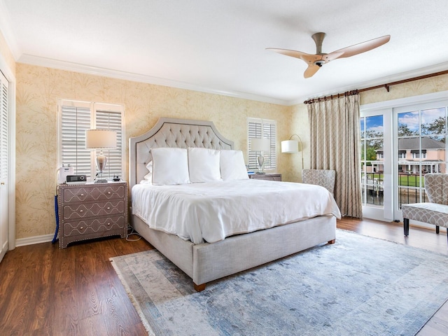 bedroom with ceiling fan, dark hardwood / wood-style floors, access to exterior, and ornamental molding