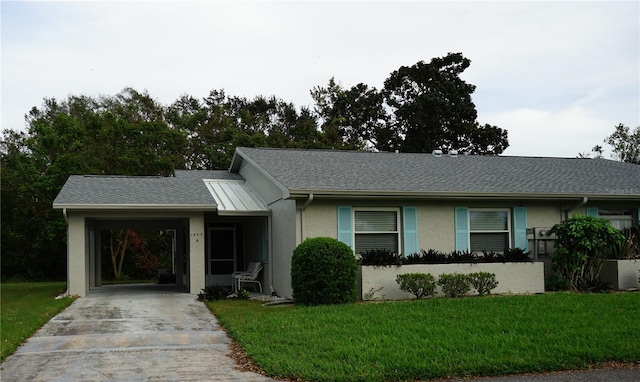 single story home with a front yard and a carport