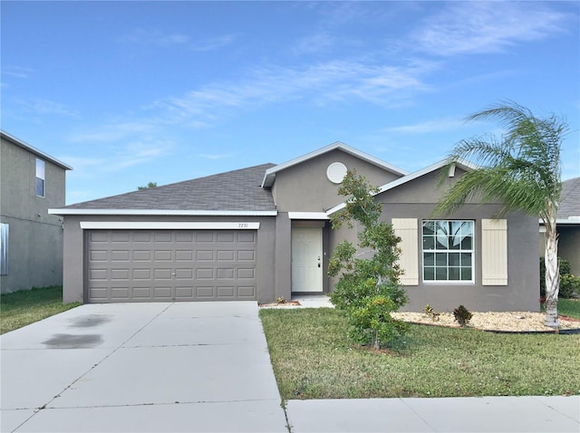 ranch-style home featuring a garage and a front yard