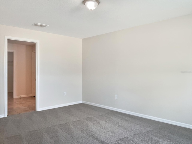 empty room featuring carpet flooring