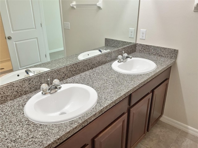 bathroom with vanity and tile patterned floors