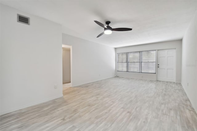 unfurnished living room featuring ceiling fan and light hardwood / wood-style flooring