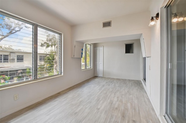4152 55th Way N Unit 1028, Kenneth City, FL 33709 - unfurnished room with light wood finished floors and baseboards