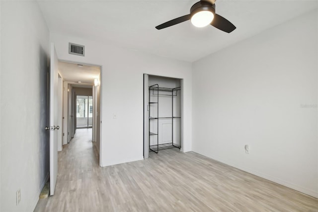 unfurnished bedroom featuring ceiling fan and light hardwood / wood-style flooring