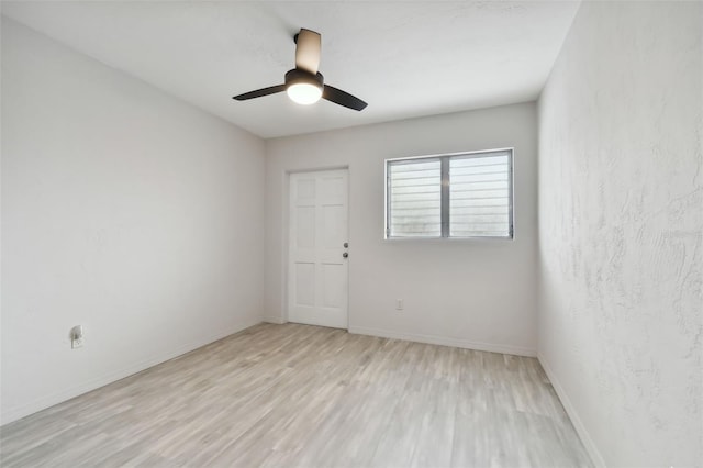 4152 55th Way N Unit 1028, Kenneth City, FL 33709 - spare room featuring light wood-style floors, baseboards, and a ceiling fan