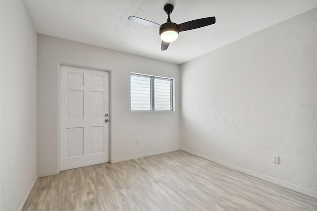 4152 55th Way N Unit 1028, Kenneth City, FL 33709 - unfurnished room with light wood-type flooring, a ceiling fan, and baseboards