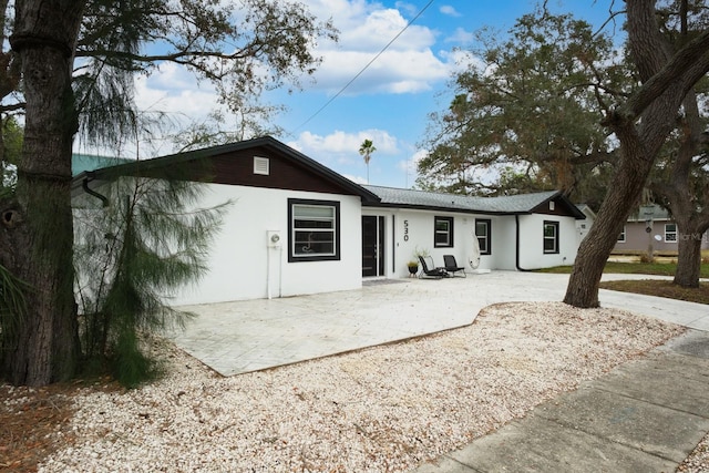 rear view of property with a patio