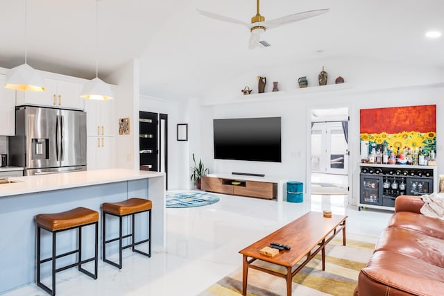 living room with lofted ceiling and ceiling fan