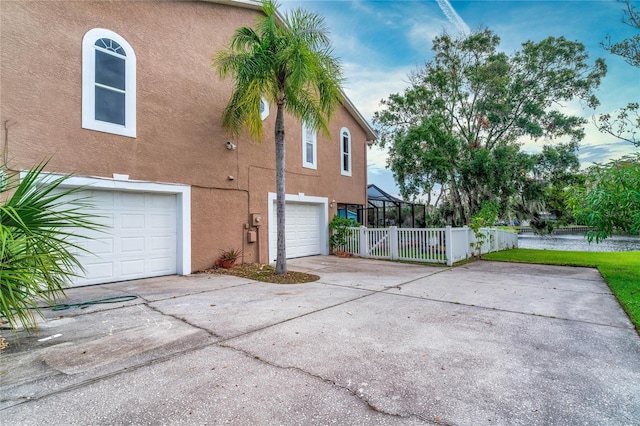 view of side of property featuring a garage