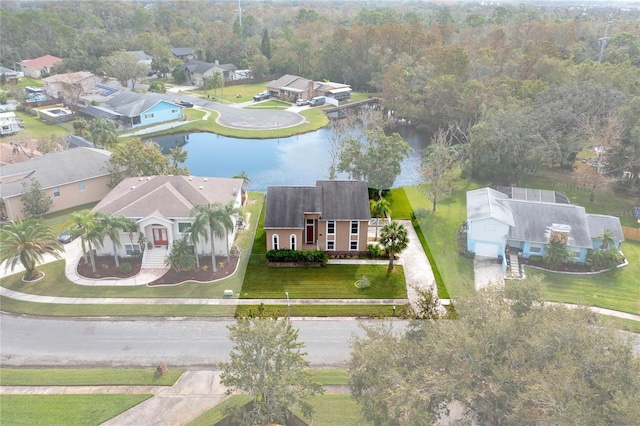 birds eye view of property with a water view