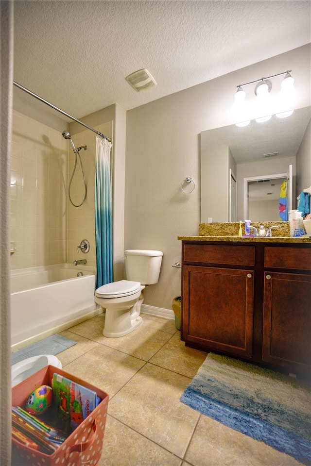 full bathroom featuring shower / bath combination with curtain, vanity, a textured ceiling, tile patterned flooring, and toilet