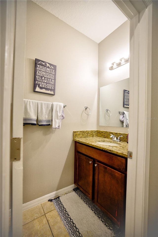 bathroom with vanity and tile patterned floors