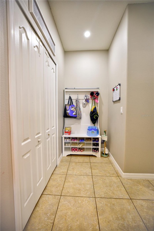 mudroom with tile patterned floors