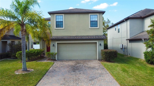 view of front of house with a front lawn and a garage