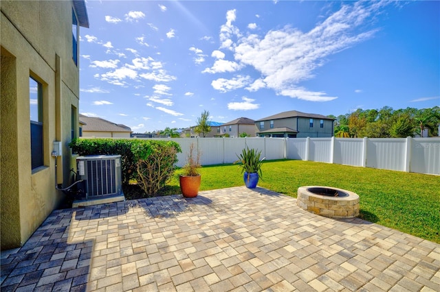 view of patio featuring a fire pit and cooling unit