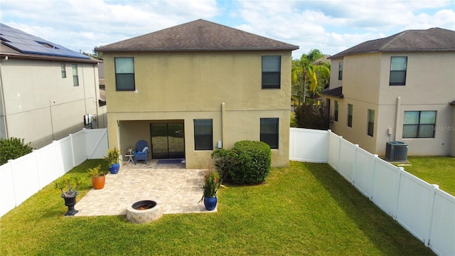 back of property featuring a patio, a yard, and cooling unit