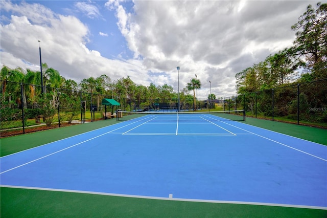 view of tennis court featuring basketball court