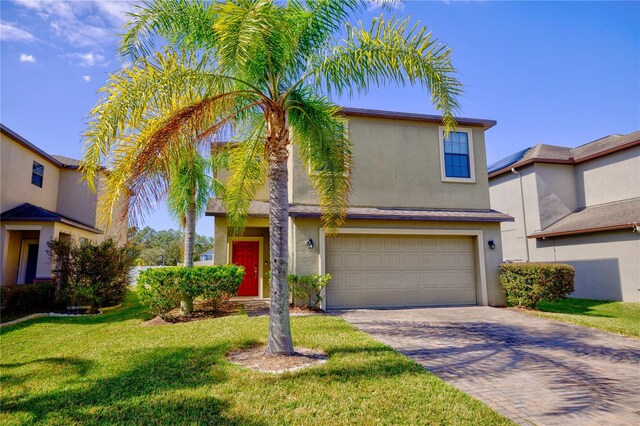 view of front of house featuring a garage and a front yard